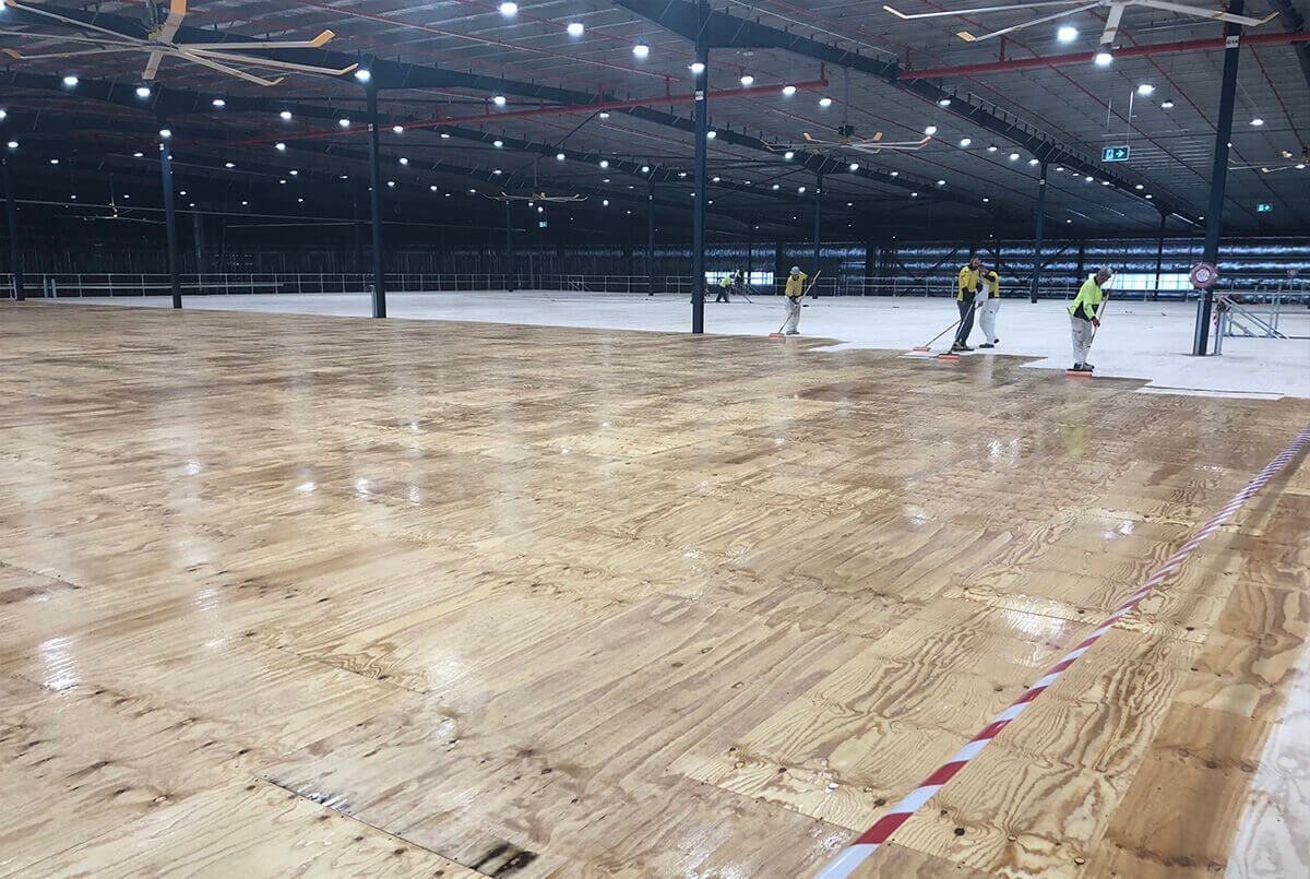 The First Coat Nears Completion On The Mezzanine Floor - Epoxy Flooring - Remedial Building Services