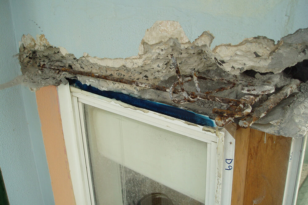 Exposed Rust Reinforcement Bar On Concrete Window - Concrete Repair - Remedial Building Services