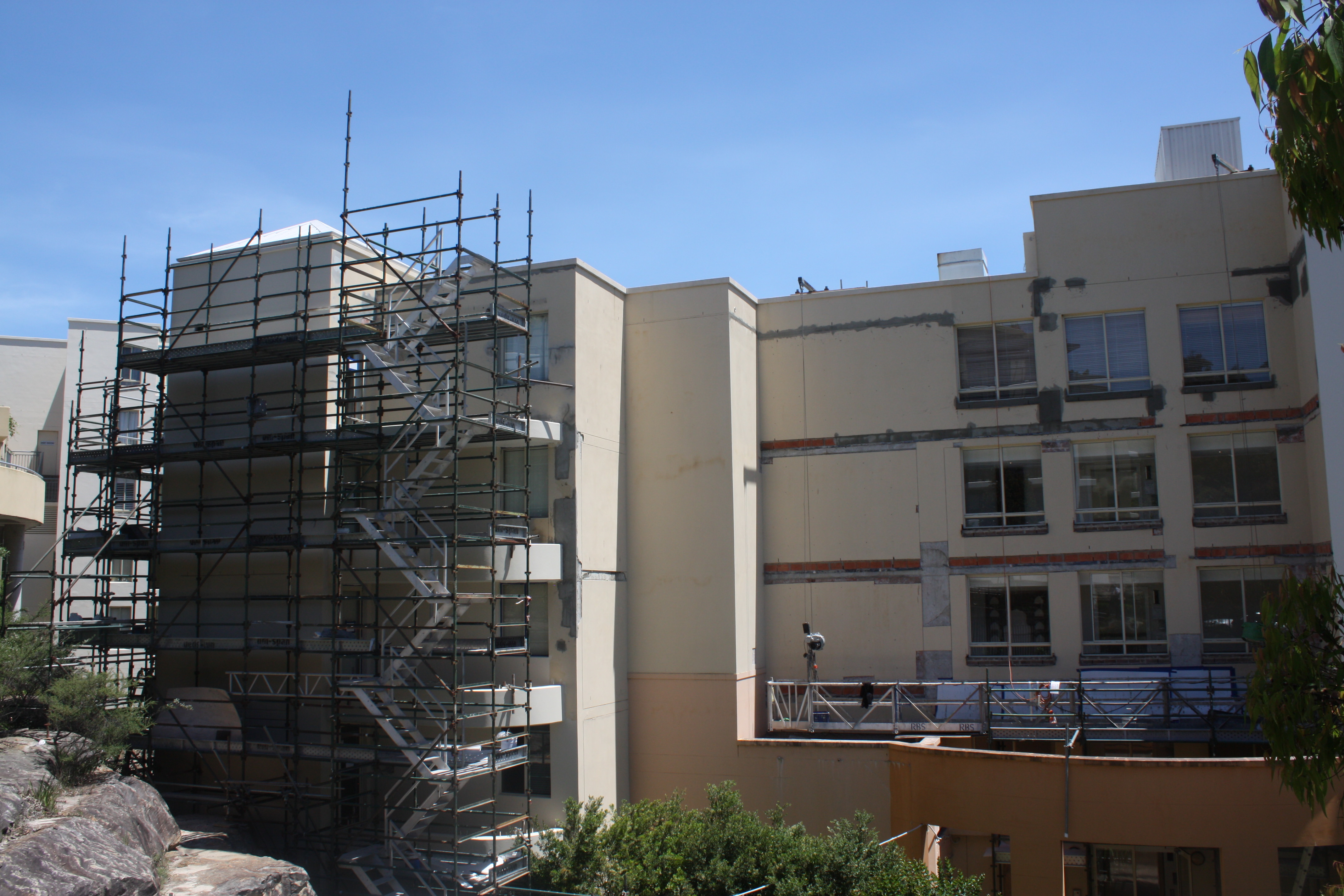 Scaffolding Around The Building For Repair Work - Façade Repair - Remedial Building Services