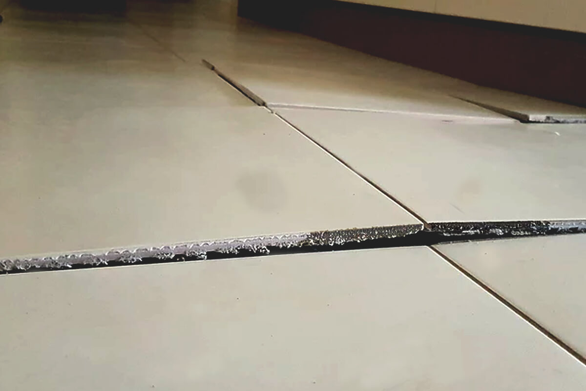 Popped Tiling - Flooring Solutions - Remedial Building Services
